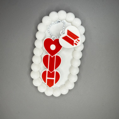 Decorative item with red heart designs on a gray background