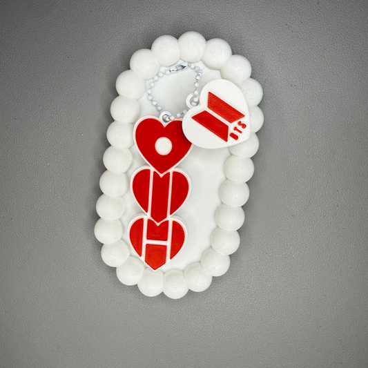 Decorative item with red heart designs on a gray background